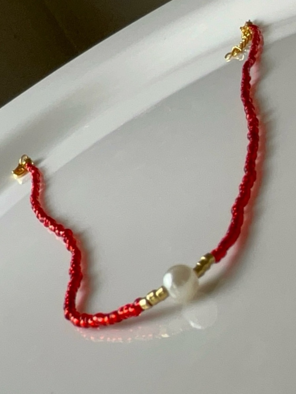 Delicate Red Seed Bead Bracelet with Pearl Accent
